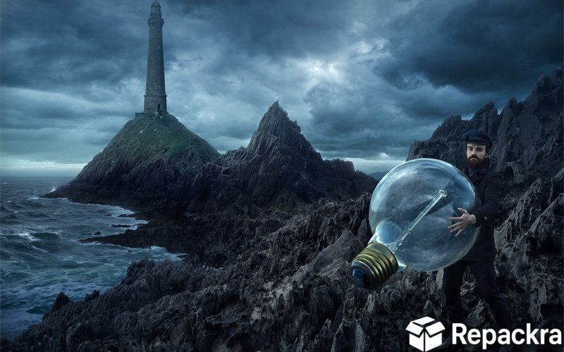 Creative photo manipulation artwork of a man holding a giant lightbulb on a rocky coast near a lighthouse