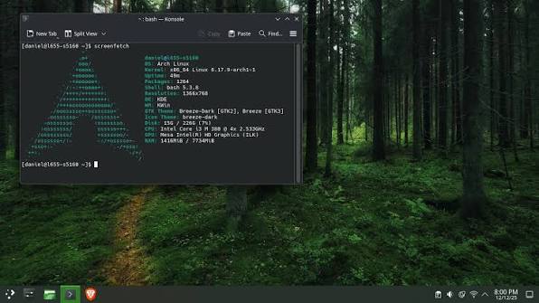An Arch Linux ISO installation desktop showing a Konsole terminal window with screenfetch system information over a green forest wallpaper.