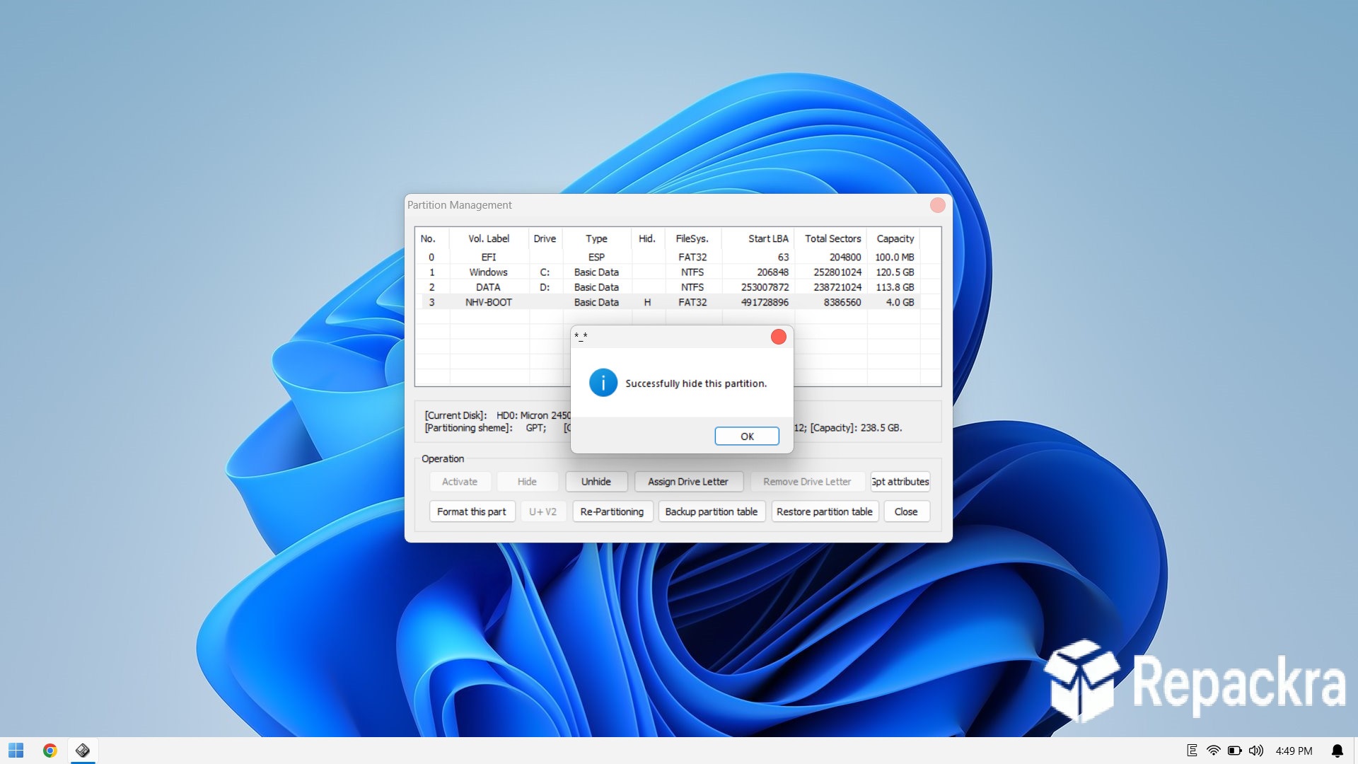 Partition Management window on Windows 11 showing a partition hidden successfully.